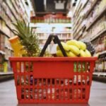 Person using Google Maps on a smartphone to navigate to the closest grocery store in 202